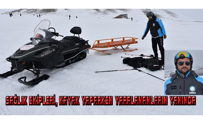 Sağlık ekipleri kayak yaparken yaralananların yanında...